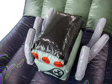 dinosaur themed inflatable bounce-and-slide attraction detail view