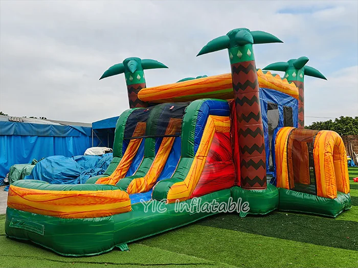 tropical themed inflatable bounce-and-slide attraction front view