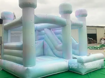 rainbow themed inflatable bounce-and-slide attraction detail view