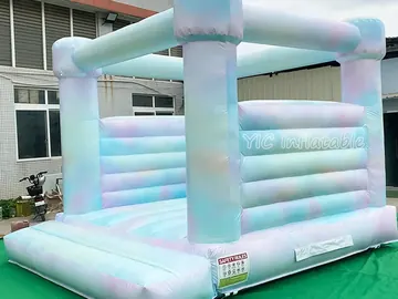 rainbow themed inflatable bounce-and-slide attraction detail view