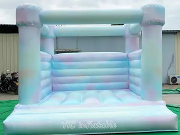 rainbow themed inflatable bounce-and-slide attraction detail view