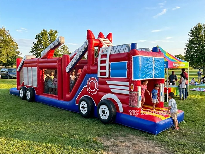 truck themed inflatable challenge course front view